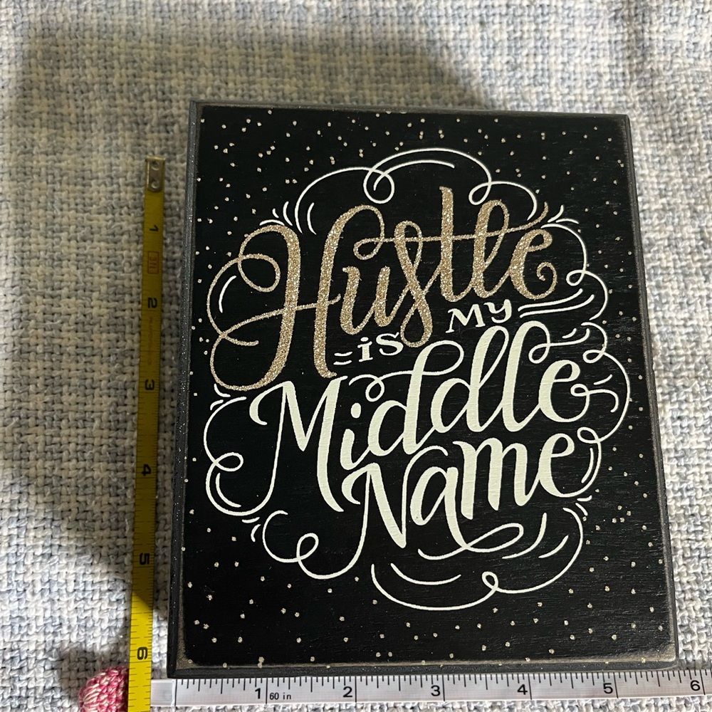 “HUSTLE IS MY MIDDLE NAME” black and Gold Decorative Sign will sit on shelf or h